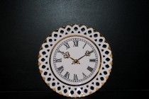 Clock made of pink porcelain incised Byzantium 24 cm on the wall.